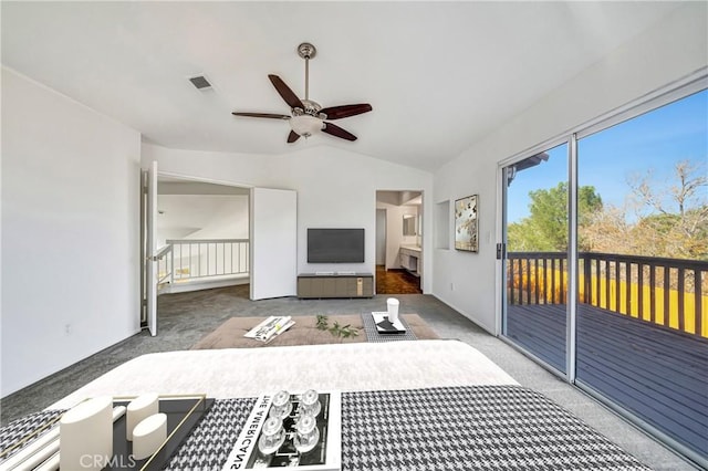 interior space featuring ceiling fan and lofted ceiling