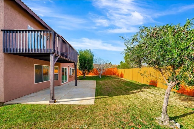 view of yard with a balcony and a patio