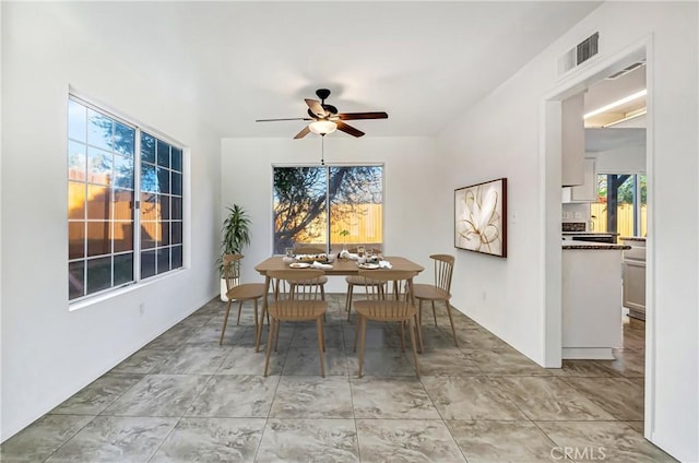 dining room featuring a ceiling fan and visible vents