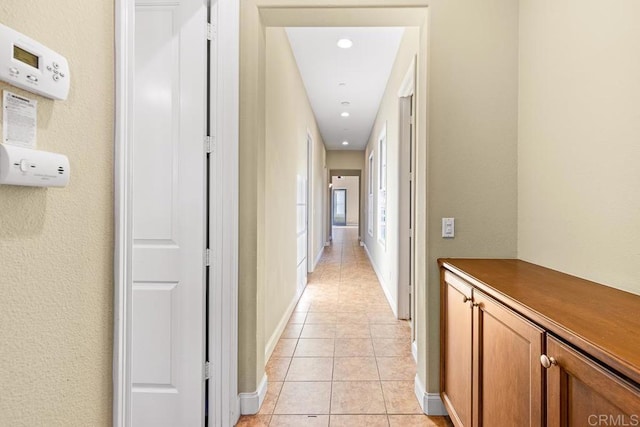 hallway with light tile patterned flooring