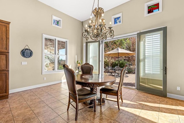 tiled dining room featuring a chandelier