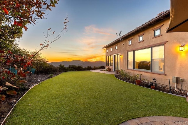 yard at dusk with a mountain view