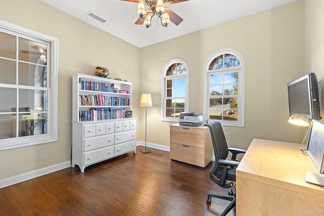 home office featuring ceiling fan and dark wood-type flooring