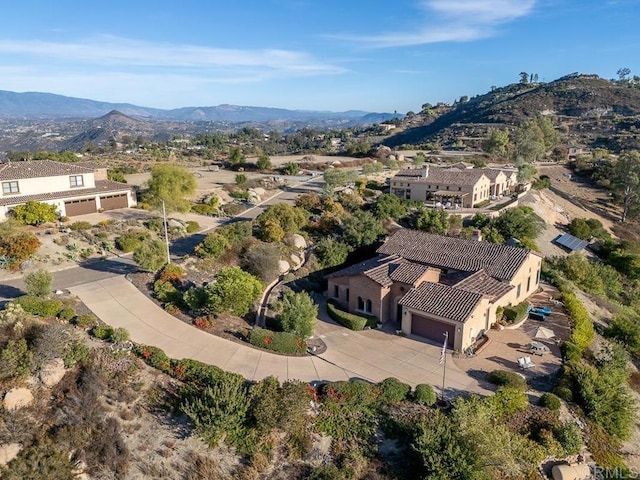 birds eye view of property with a mountain view