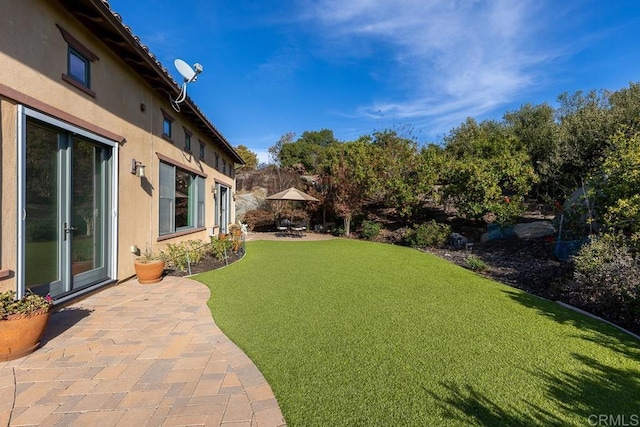 view of yard with a patio area