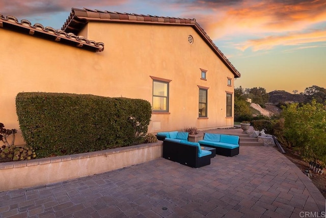 exterior space with a patio area and an outdoor living space