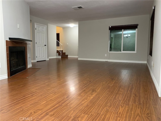 unfurnished living room featuring hardwood / wood-style floors