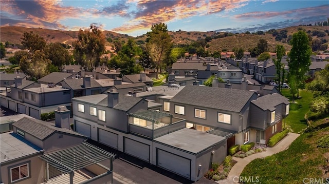 drone / aerial view featuring a mountain view and a residential view