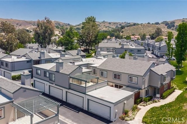 drone / aerial view featuring a mountain view and a residential view