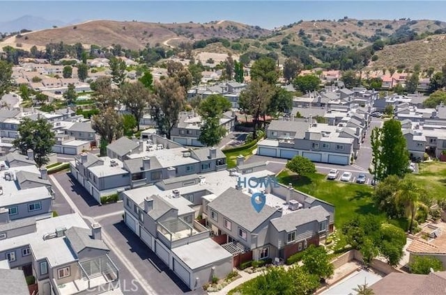 bird's eye view with a residential view and a mountain view