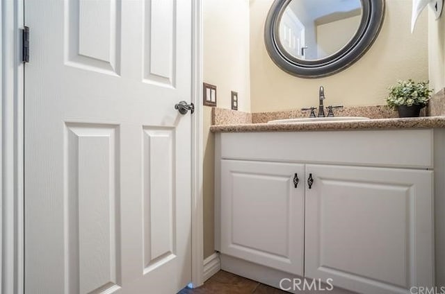 bathroom featuring tile patterned floors and vanity