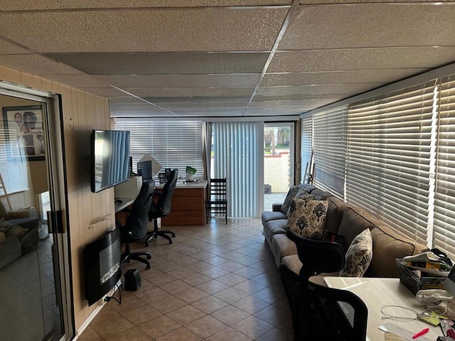 tiled home office with a drop ceiling