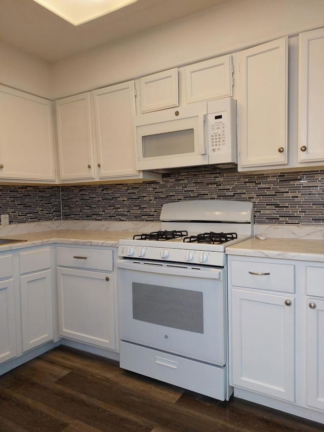 kitchen with white cabinets, white appliances, dark wood-type flooring, and tasteful backsplash