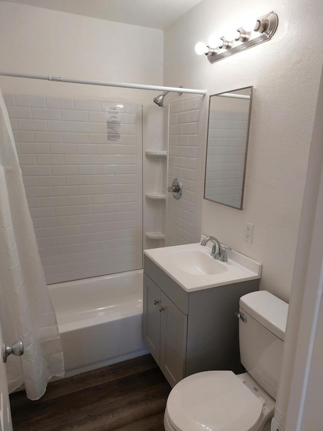 full bathroom with hardwood / wood-style floors, shower / bath combination with curtain, toilet, and vanity