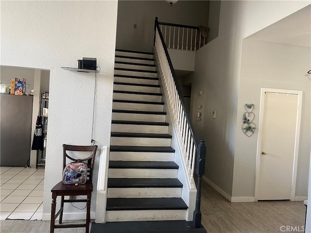 stairs featuring hardwood / wood-style flooring