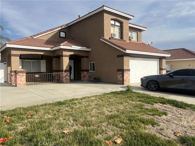 view of front of home featuring a garage and a front lawn