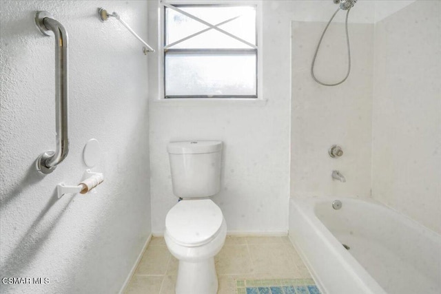 bathroom featuring tile patterned floors, toilet, and shower / bathing tub combination