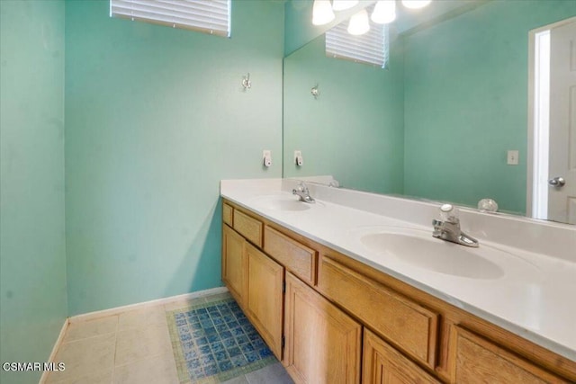 bathroom with tile patterned floors and vanity