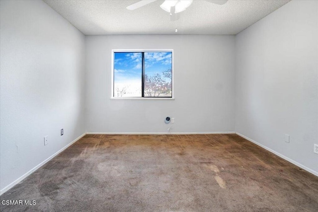 empty room featuring carpet flooring, a textured ceiling, and ceiling fan