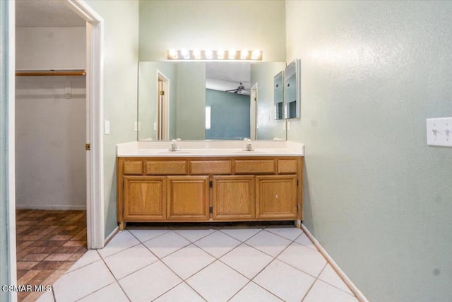 bathroom with vanity, tile patterned floors, and ceiling fan