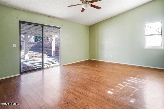 unfurnished room featuring ceiling fan and hardwood / wood-style flooring