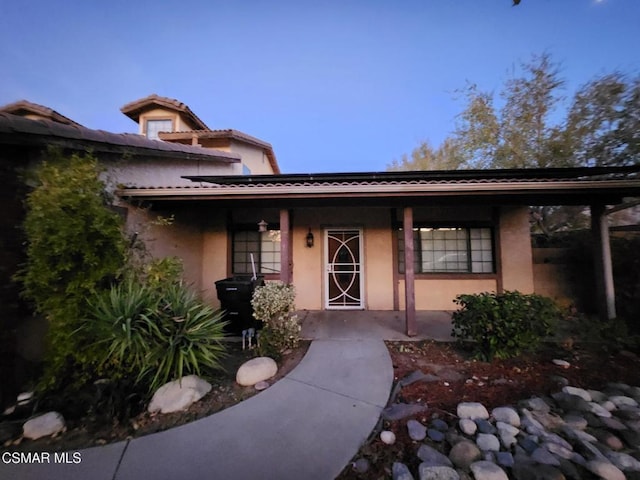 exterior space featuring covered porch