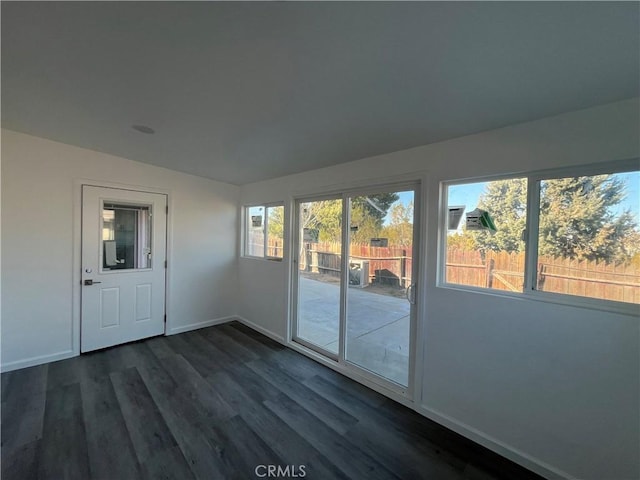 unfurnished sunroom with lofted ceiling