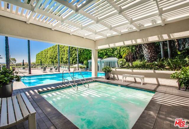 view of pool with a pergola