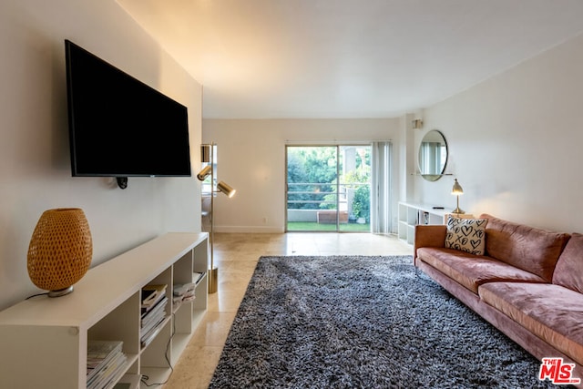 living room with light tile patterned floors