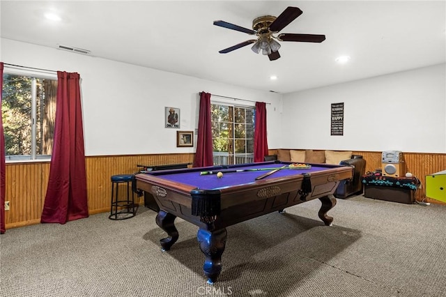 recreation room featuring carpet flooring, pool table, ceiling fan, and wood walls