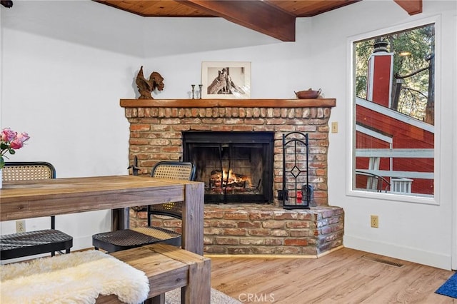 room details featuring wood-type flooring and a fireplace