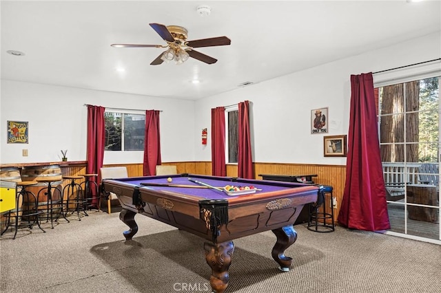 game room featuring ceiling fan, pool table, carpet floors, and wood walls