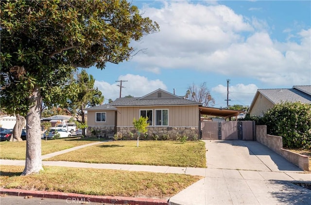 view of front facade with a front lawn and a carport