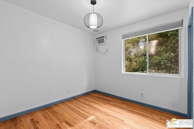 spare room with wood-type flooring