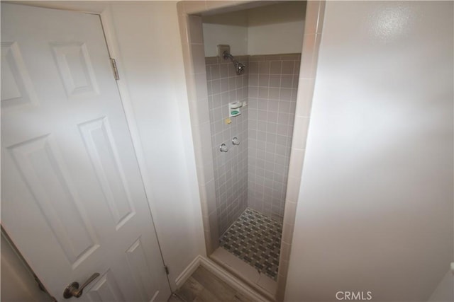 bathroom with a tile shower