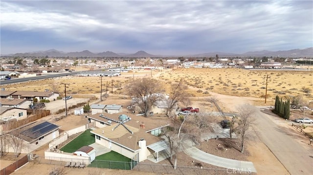 birds eye view of property with a mountain view