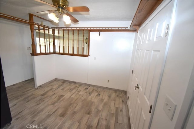 spare room with hardwood / wood-style flooring and ceiling fan