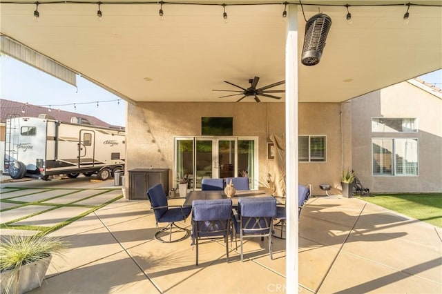 view of patio / terrace featuring ceiling fan and french doors