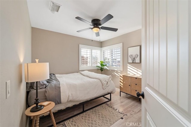 bedroom featuring light hardwood / wood-style flooring and ceiling fan