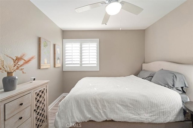 bedroom featuring hardwood / wood-style floors and ceiling fan