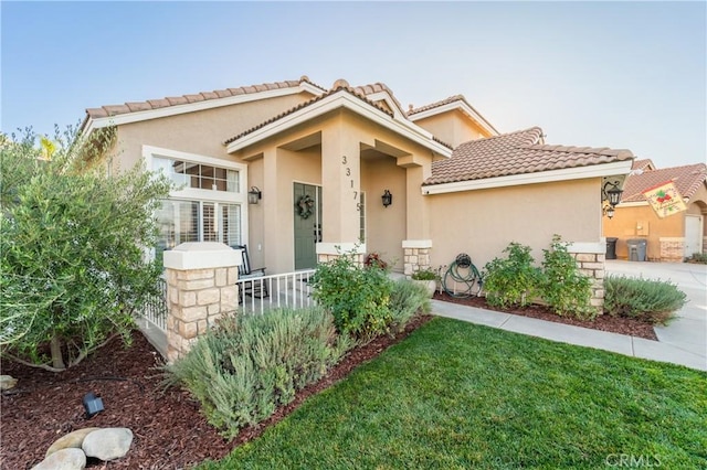 mediterranean / spanish-style house with covered porch