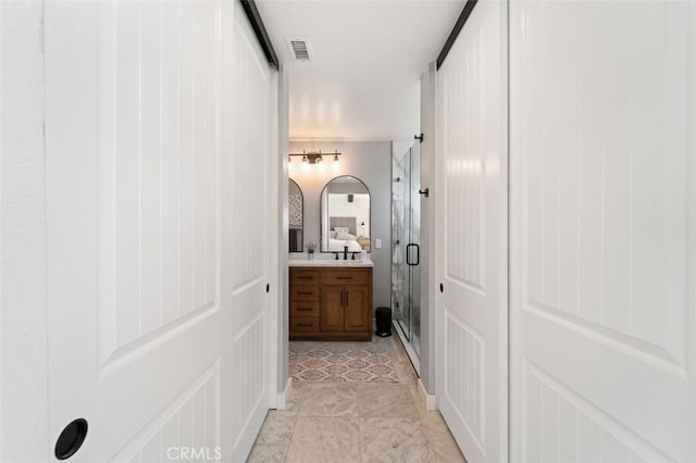 bathroom with vanity, tile patterned floors, and an enclosed shower