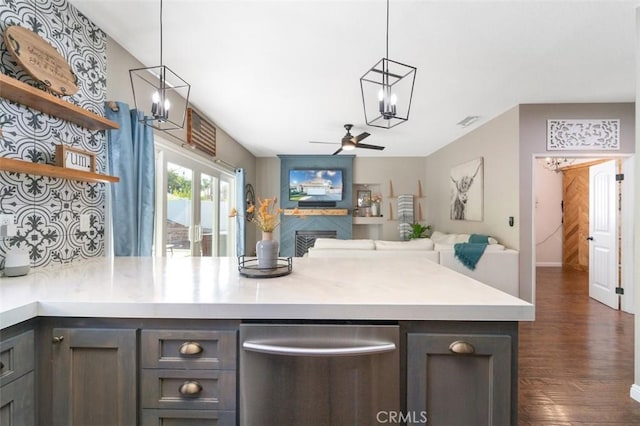 kitchen with stainless steel dishwasher, ceiling fan, pendant lighting, and dark hardwood / wood-style floors