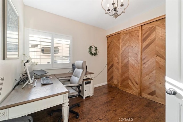 home office featuring dark hardwood / wood-style flooring and a chandelier