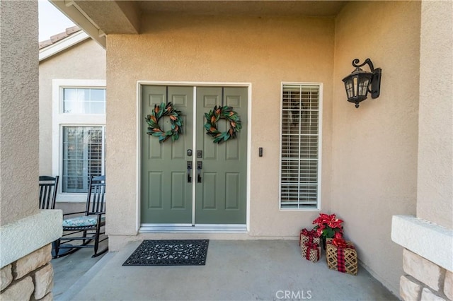 doorway to property featuring a porch