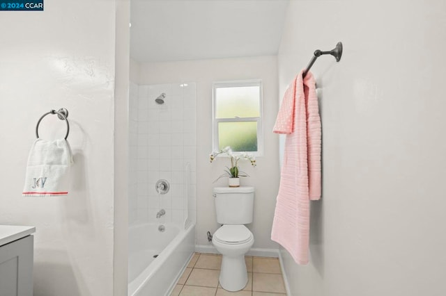 full bathroom featuring toilet, tile patterned flooring, tiled shower / bath combo, and vanity