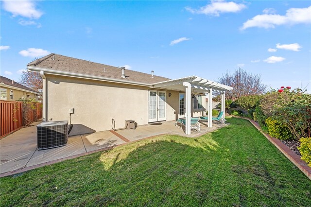 back of property with french doors, a pergola, central AC, and a patio area