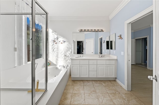 bathroom with tiled tub, tile patterned flooring, vanity, and ornamental molding