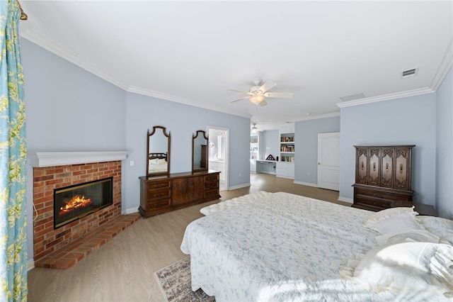 bedroom with ceiling fan, light hardwood / wood-style flooring, and ornamental molding