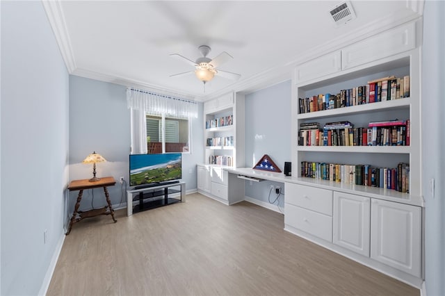 miscellaneous room featuring built in features, light hardwood / wood-style flooring, ceiling fan, and ornamental molding